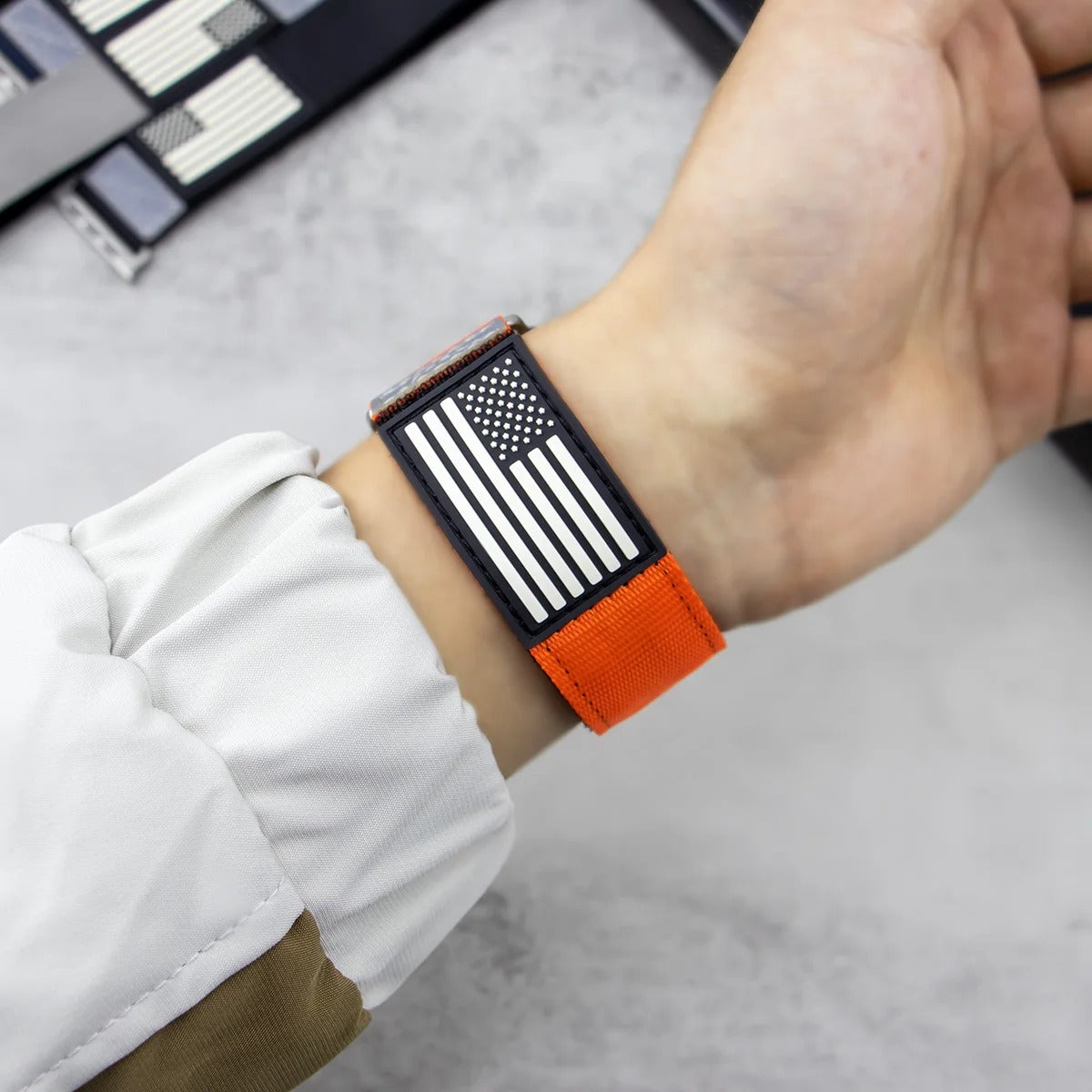 Person Wearing American Flag Apple Watch Band in Orange