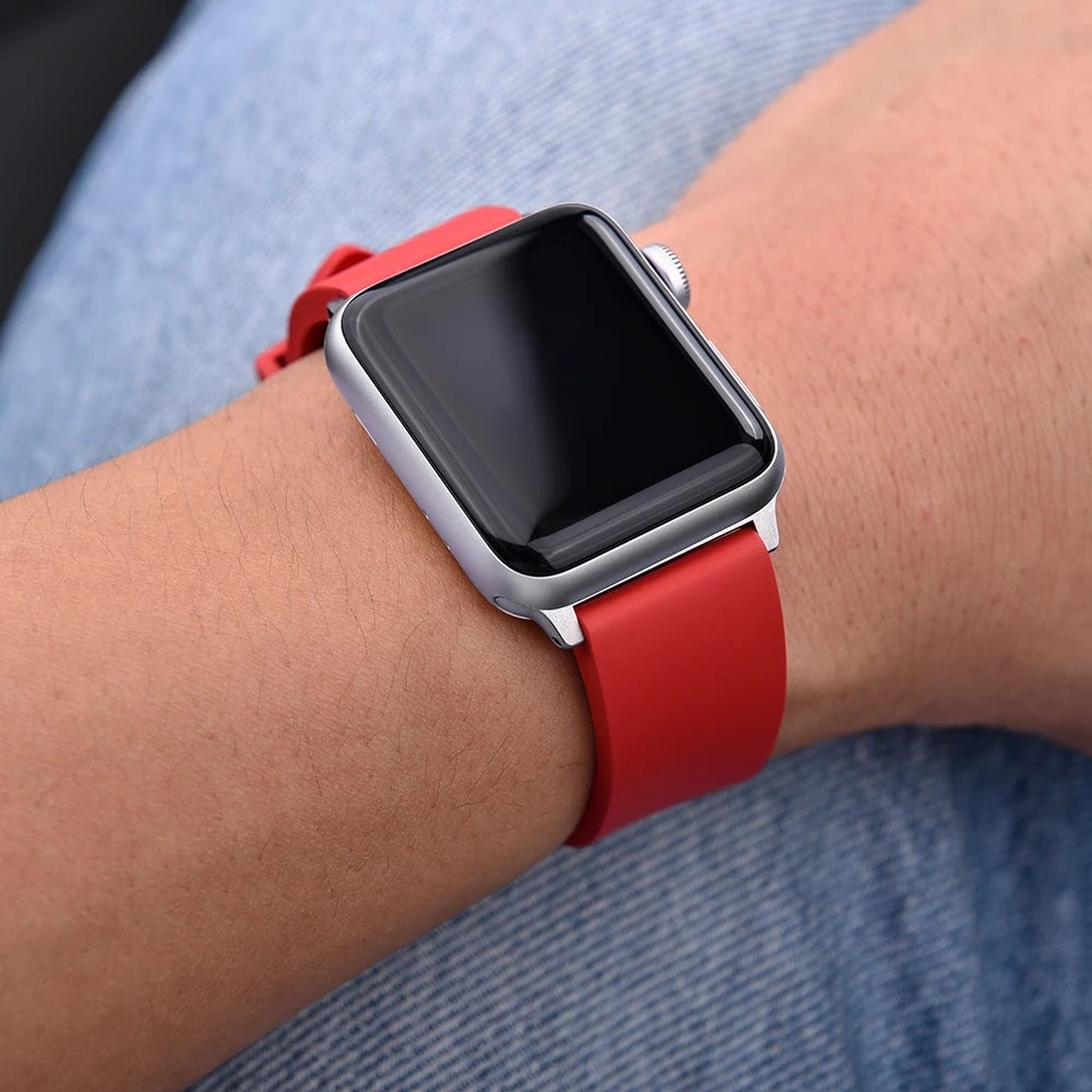 Person Wearing Apple Watch Sport Band Red