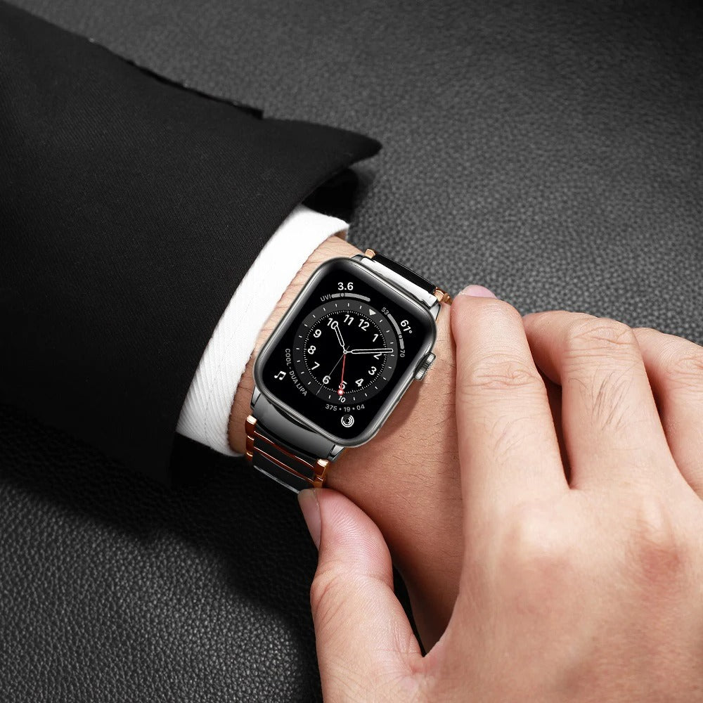 Person Wearing Ceramic Apple Watch Band in Black/Gold