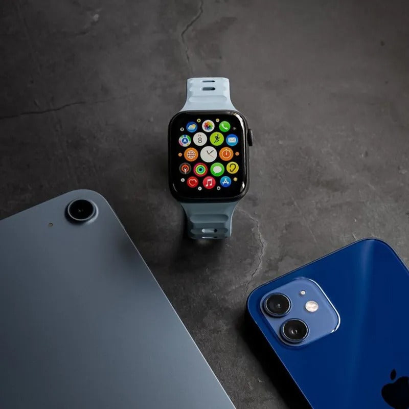 Light Blue Apple Watch Band Front Facing With Other Electronics