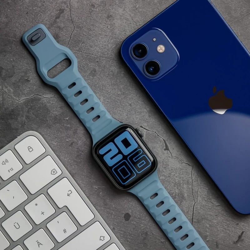 Light Blue Apple Watch Band With Other Electronics