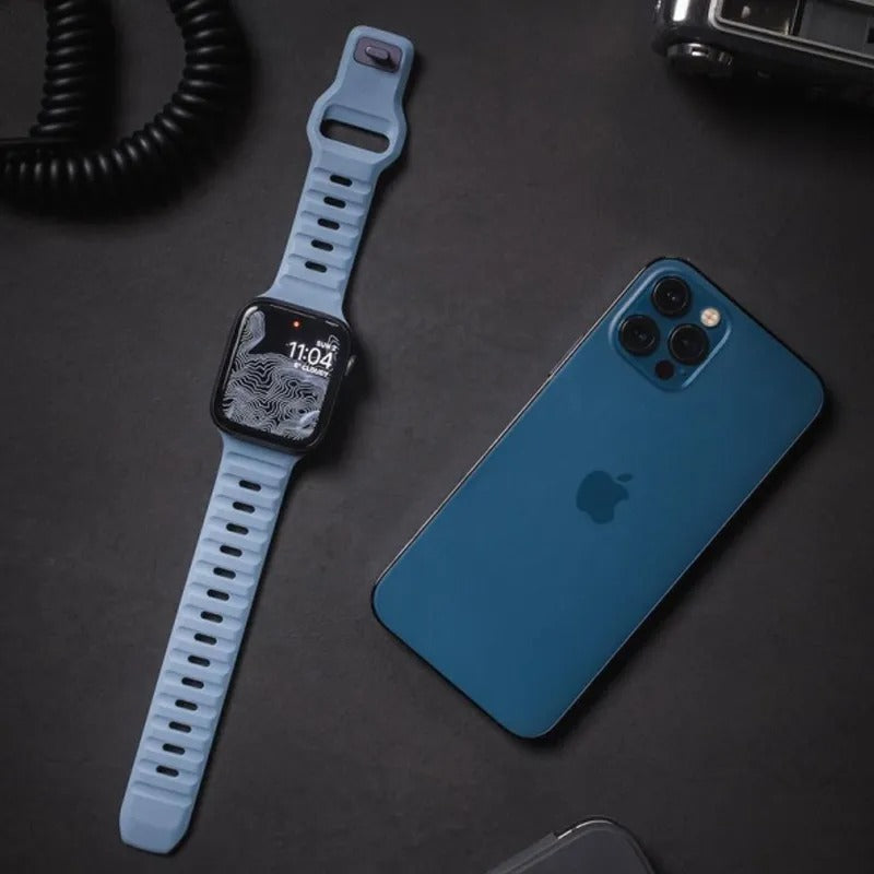 Light Blue Apple Watch Band Beside iPhone
