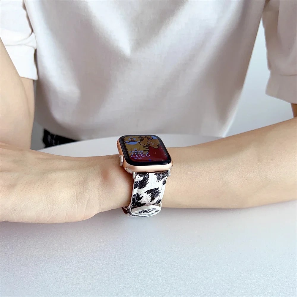 Person Wearing Cow Print Apple Watch Band